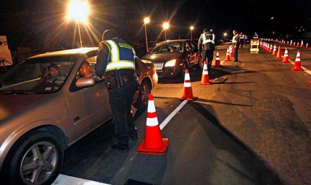 DUI  task force checking sobriety at night.